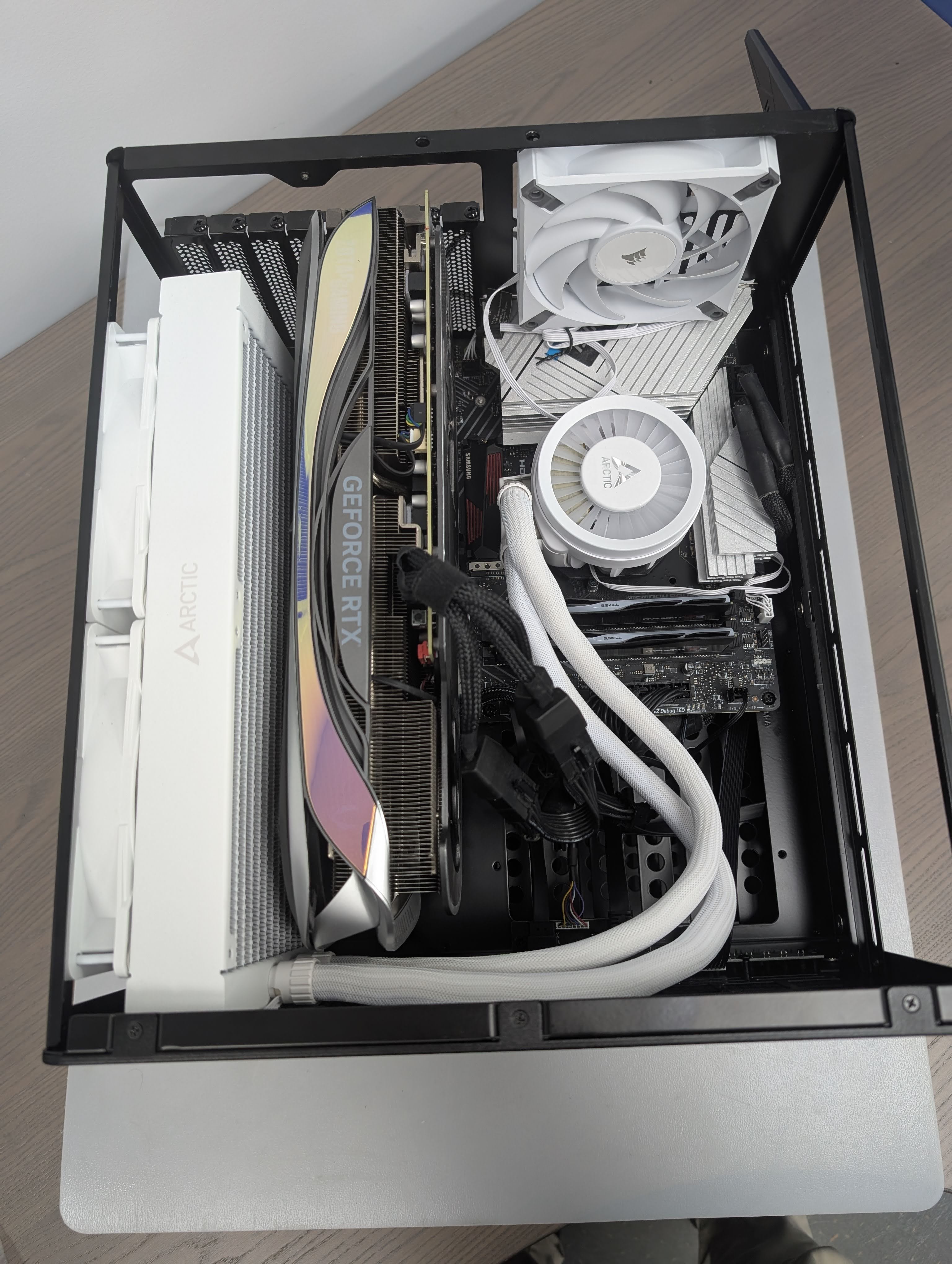 I originally had a 360AIO Cooler from my original system which I may have been able to place at the front but not with this graphic card. It was also not possible to place it on the right side due to the motherboard component being just to tall. In the end I rushed out and picked up the 240AIO Cooler to make this all work. As a drawback to this rush I had to sacrifice the PCI Slots just under the AIO Water cooler for the time being. The Plan will at some point be to relocate my Main Boot drive to under the AIO and use a M.2 SATA Controller to eventually fully utilize the case.